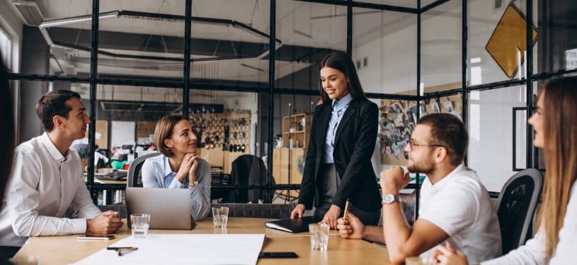 Group of people working out business plan in an office